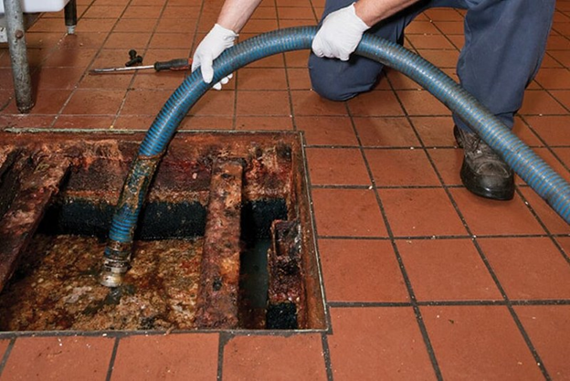 Pumping Out Grease Trap in Floor